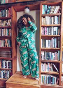 woman wearing Bagheera long sleeve pajamas, bookcase